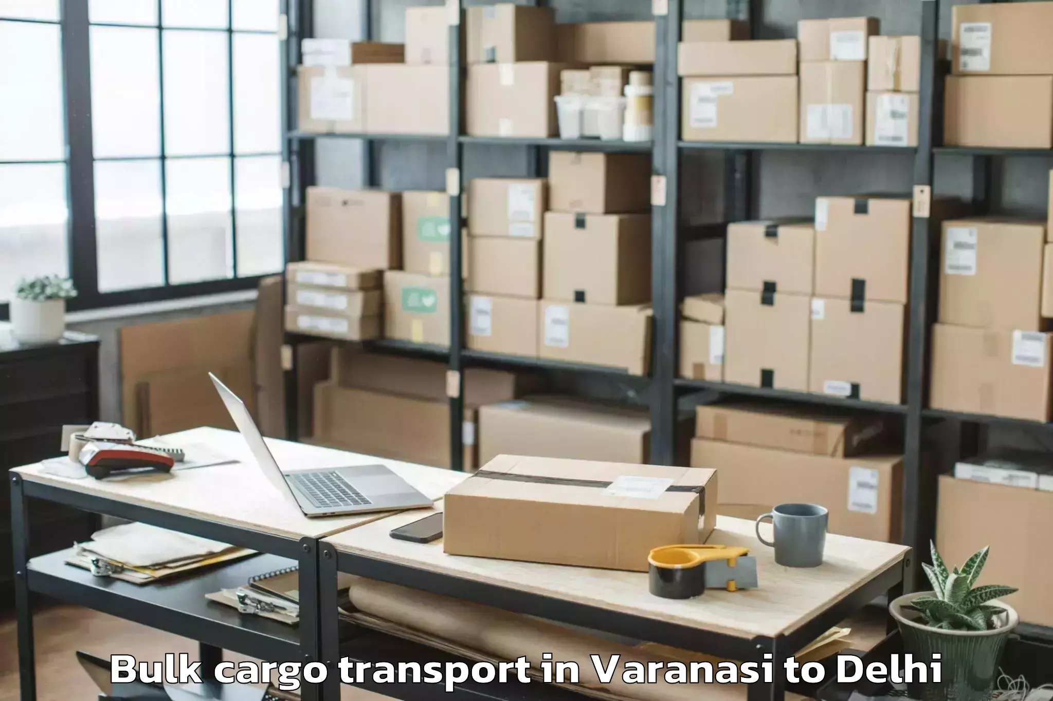 Book Varanasi to Dlf Promenade Mall Bulk Cargo Transport Online